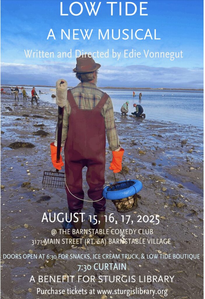 Man with a wire clam bucket and orange gloves standing on a mud flat.